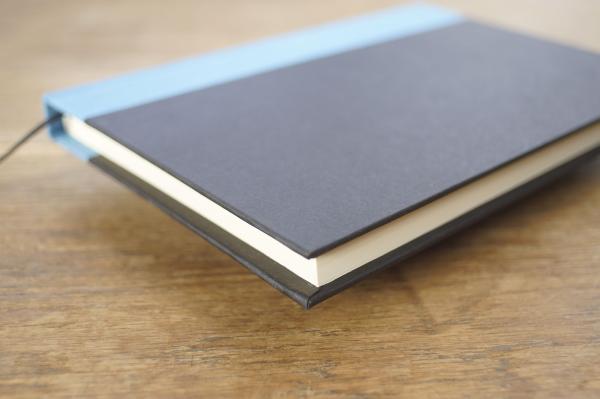 Writing and notebook black, with light blue linen